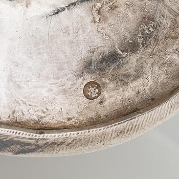 A silver cream jug, maker's mark of Michael Takkinen, St. Petersburg 1856.