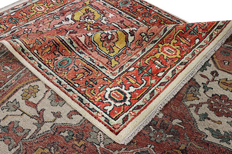 An oriental carpet with Mamluk design, c. 367 x 280 cm.