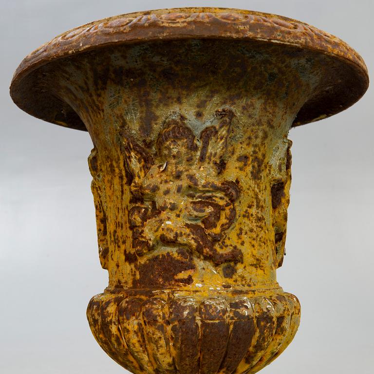 A pair of cast iron garden urns fist half of the 20th century.