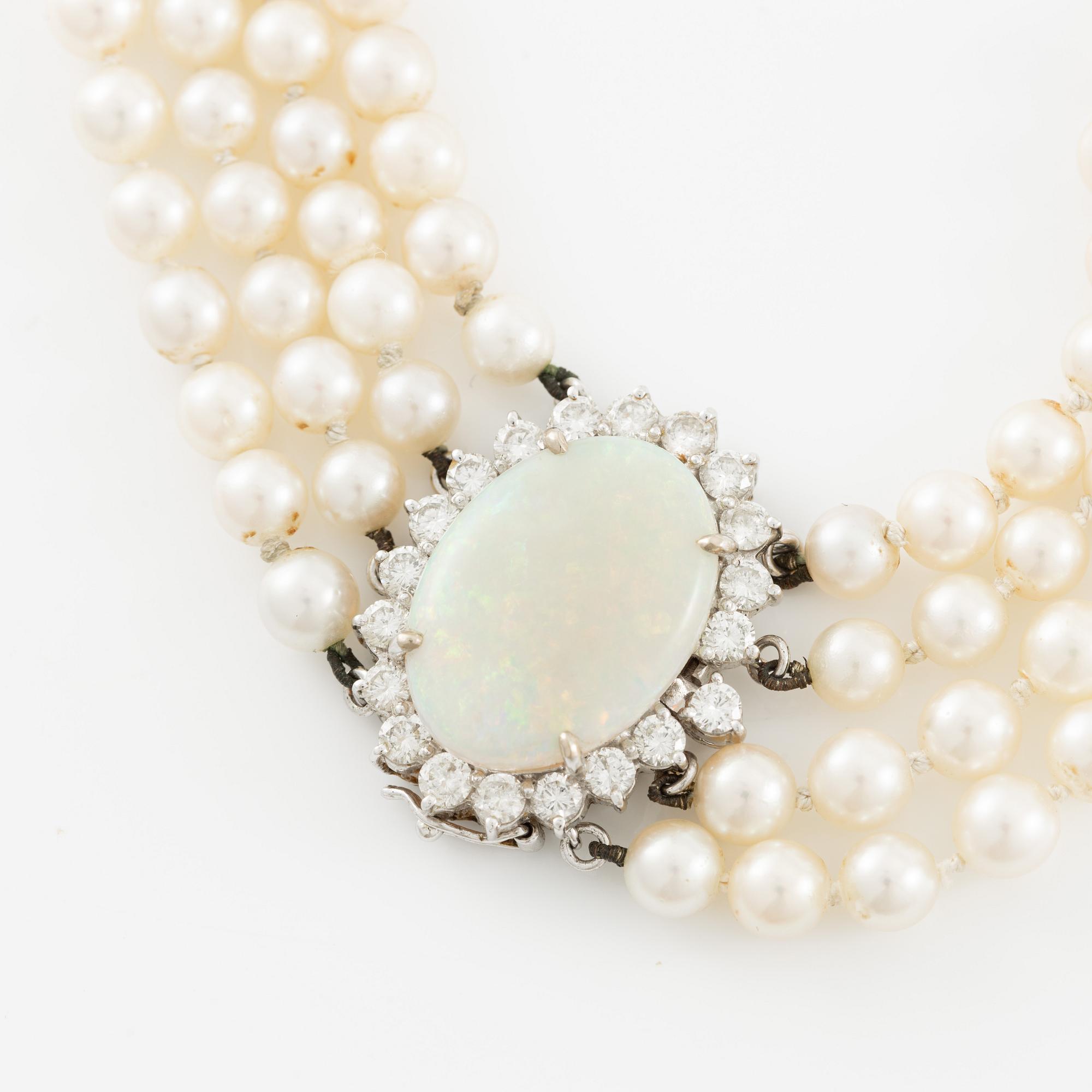 Necklace, four-row with cultured pearls, clasp 18K white gold set with opal and brilliant-cut diamonds.