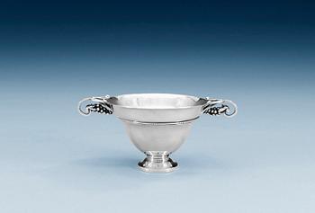 918. A GEORG JENSEN tea strainer and stand, Copenhagen, the strainer 820/1000 silver, the stand, design nr 251, sterling.