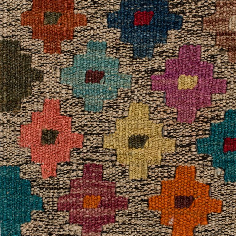 An oriental kilim, around 285 x 215 cm.