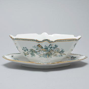 A earthenware table set of 136 pcs "Vexiö Guld",  by Arvid Ekberg, Gustafsberg, from around year 1900.