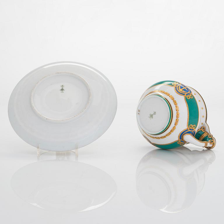A cup and saucer from the Derzhava service, Imperial Porcelain Manufactory, St. Petersburg, late 19th century.