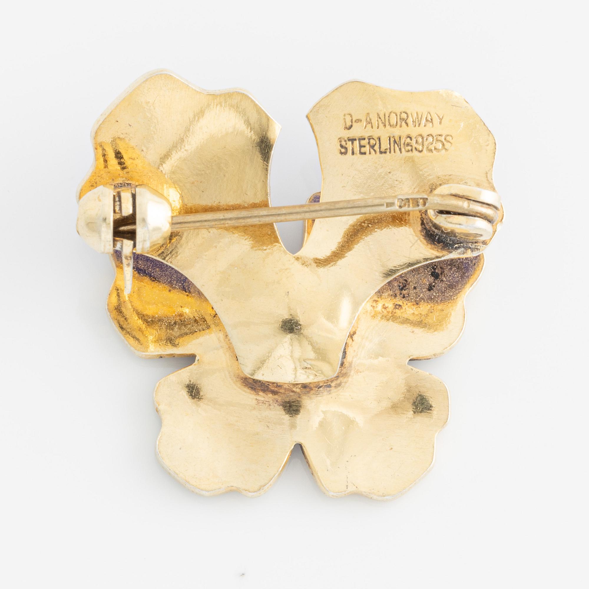 David Andersen, bracelet and two brooches, gilded silver and enamel, Norway.