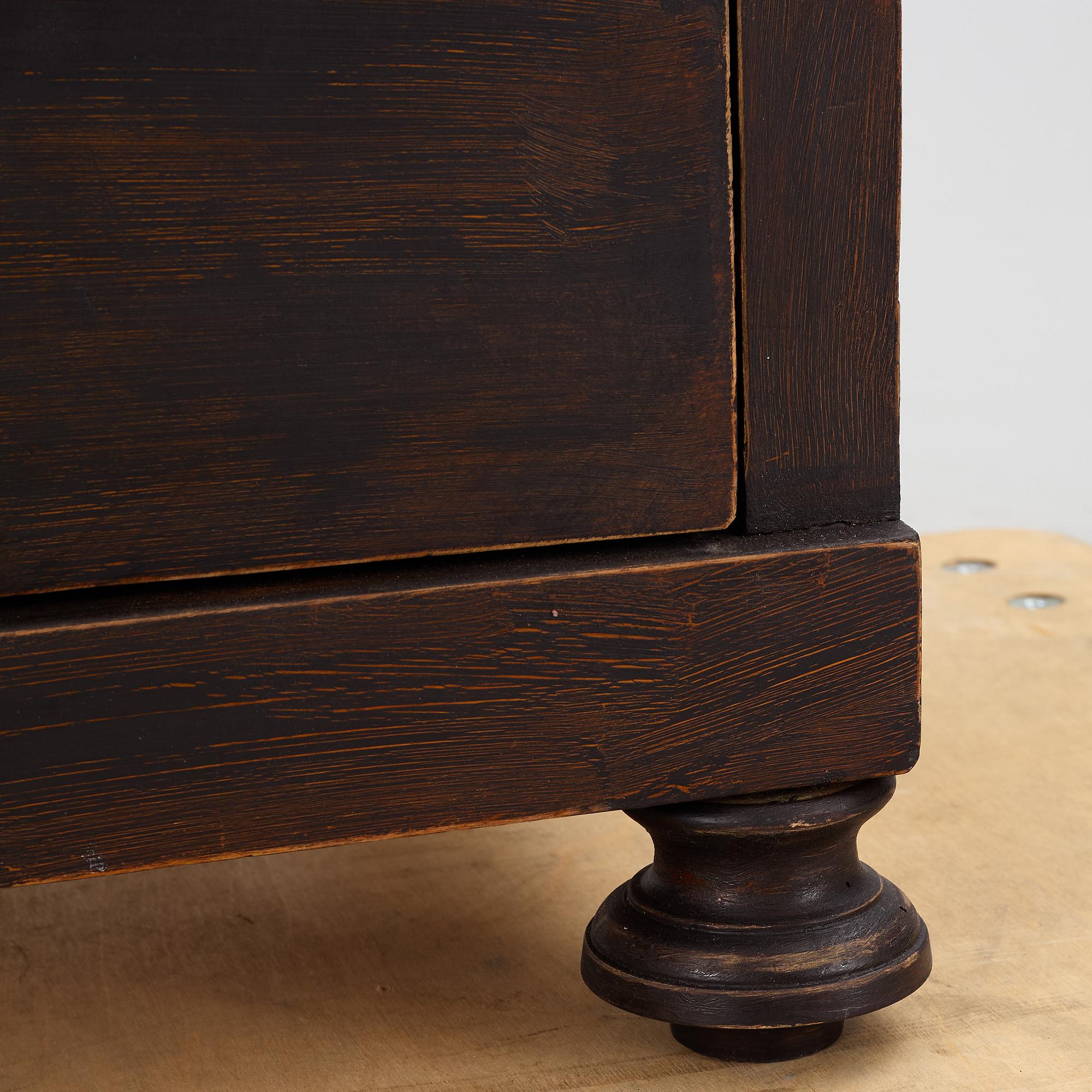 A chest of drawers, circa 1900.