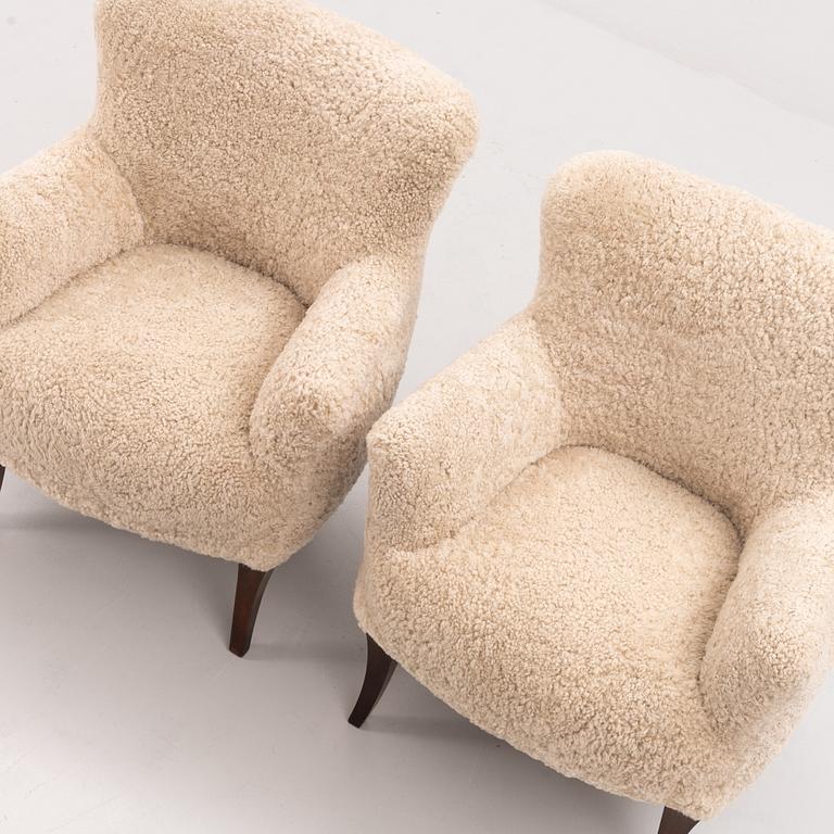 A pair of Swedish Modern armchairs, mid 20th century.