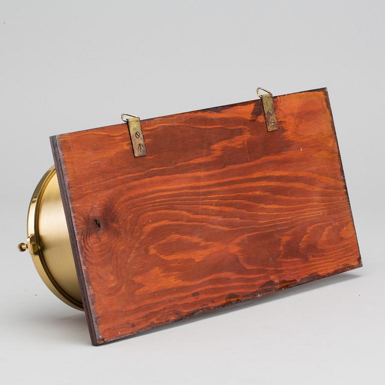 A BRASS MARINE CLOCK AND BAROMETER BY STOCKBURGER.