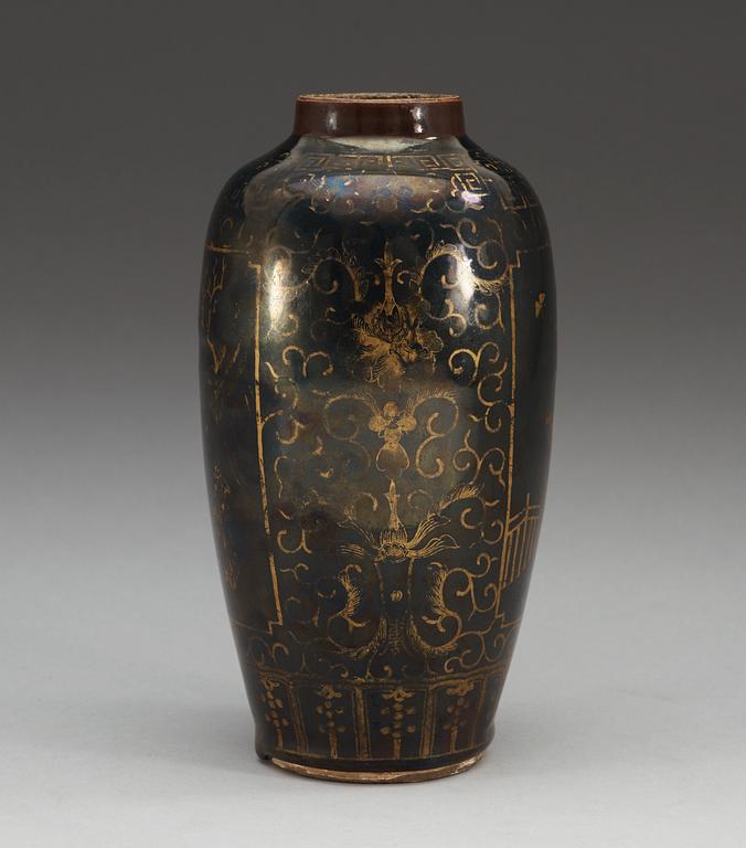A gilt black vase, Qing dynasty, 18th Century, with Kangxis six character mark.