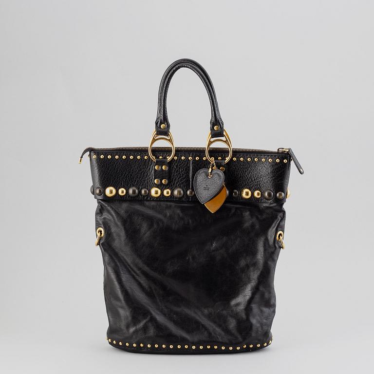 Gucci, a black leather handbag.