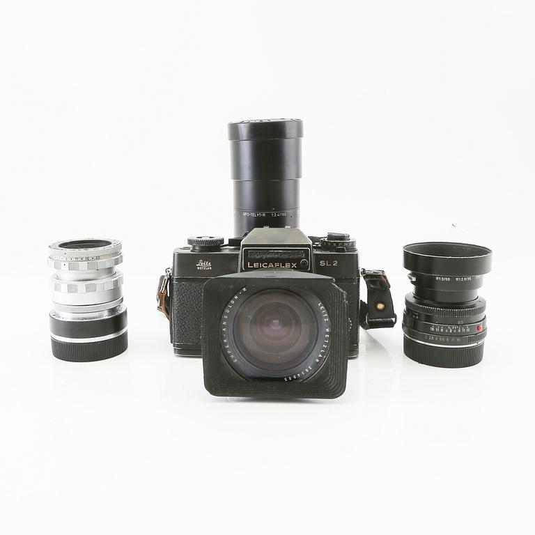 Leica camera with 4 lenses.