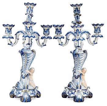 1451. A pair of Royal Copenhagen four light candelabra, ca 1900.