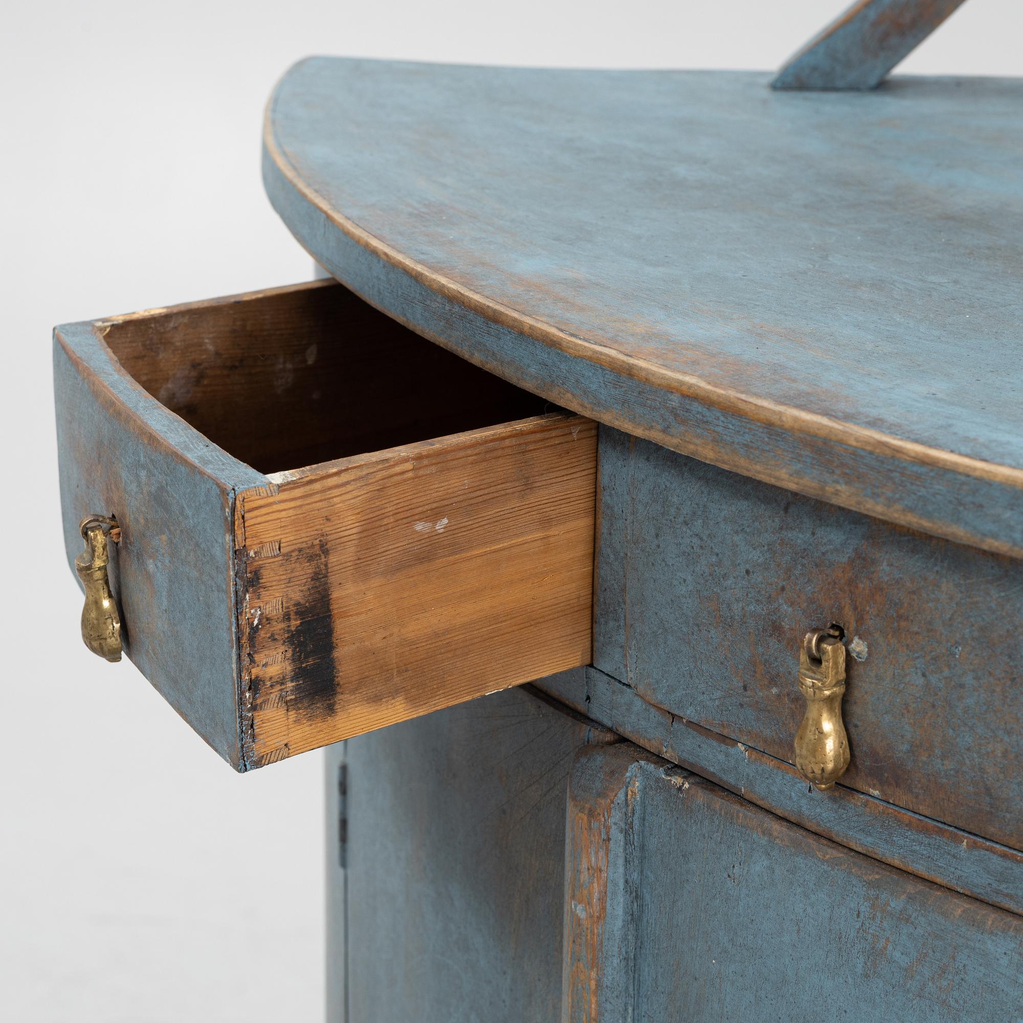 A painted corner cabinet, late 19th century.