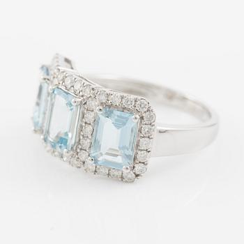 Ring in 18K white gold with three aquamarines and brilliant-cut diamonds.