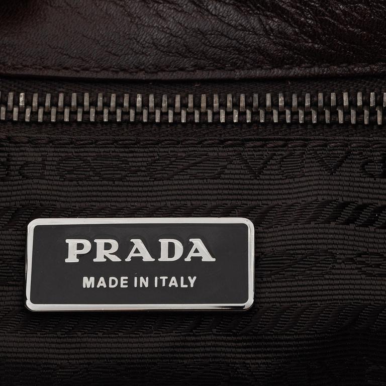 Prada, a brown leather bag.