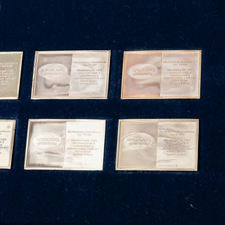 Plaketter, 12 st, silver, "De Historiska Volvobilarna 1927-1977", Franklin Mint.