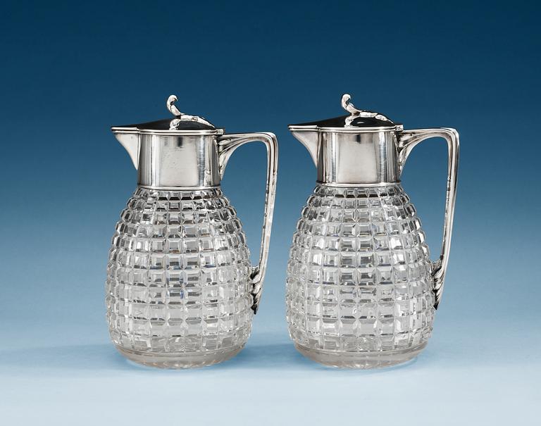 A PAIR OF SWEDISH SILVER AND GLASS WINE-JUGS, Makers mark of W.A. Bolin, Stockholm 1920.