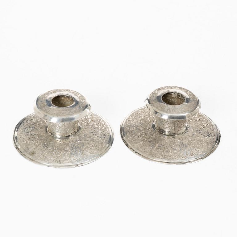 Two pairs of Persian silver candle holders, 20th century.