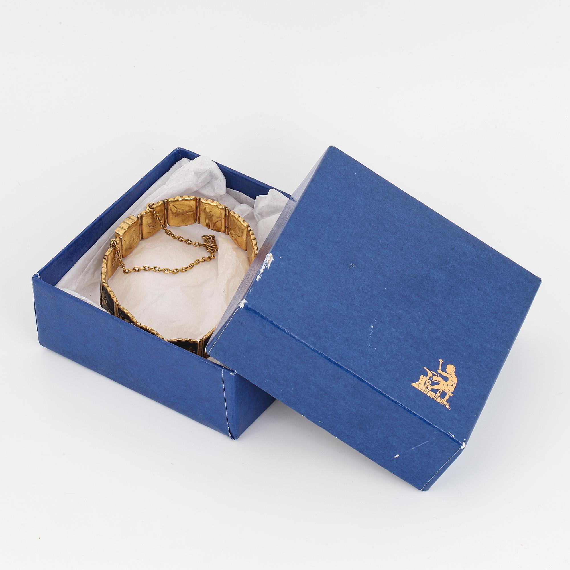 ARMBAND, gul metall med japanskt motiv.