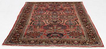 A semi-antique 'Mahajiran' Sarouk carpet, c 275 x 185 cm.