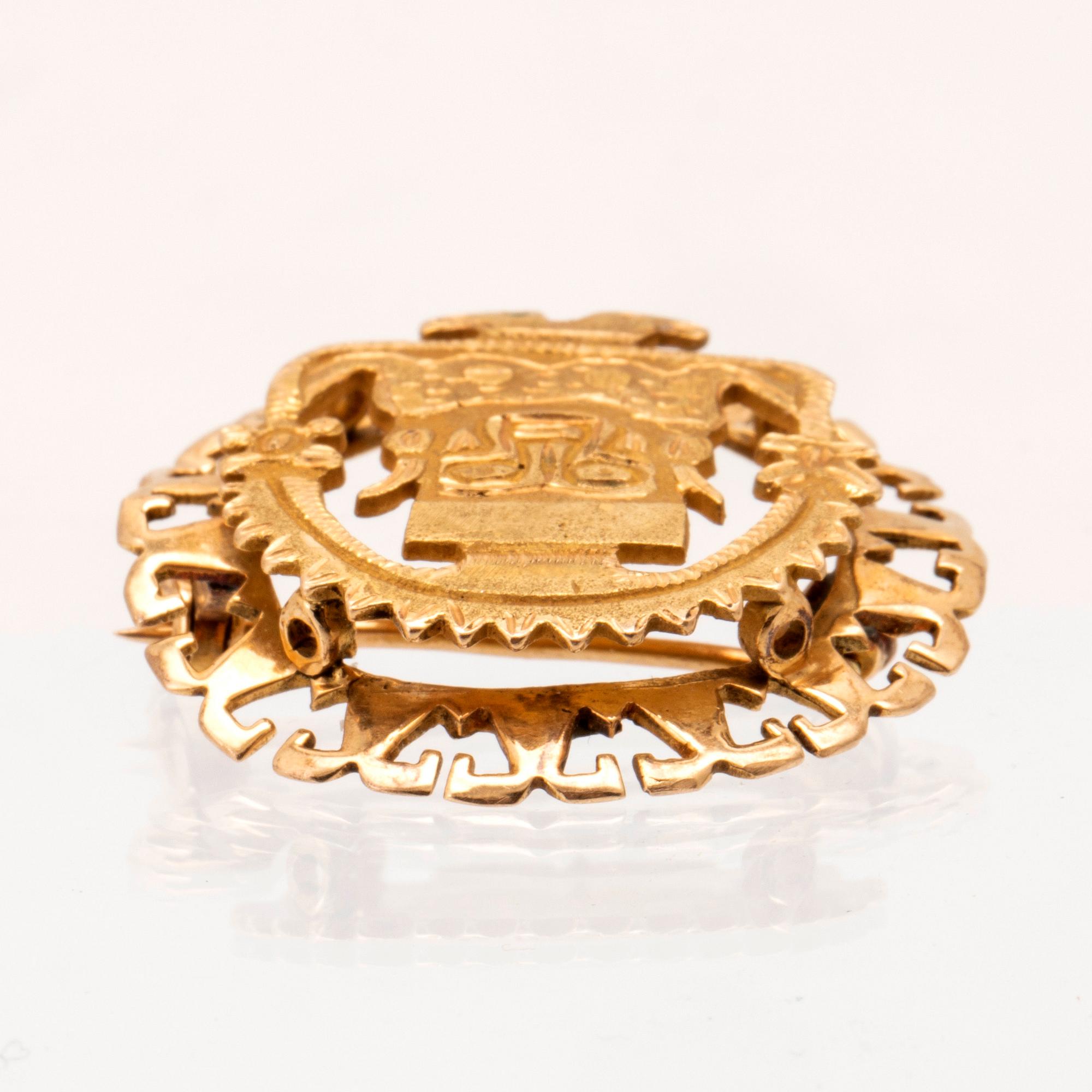 Brosch 18K guld Sydamerika.