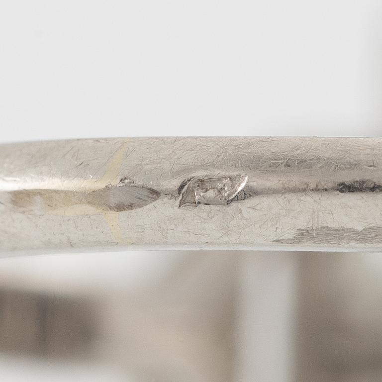 Platinum ring with sapphire and old-cut diamonds.