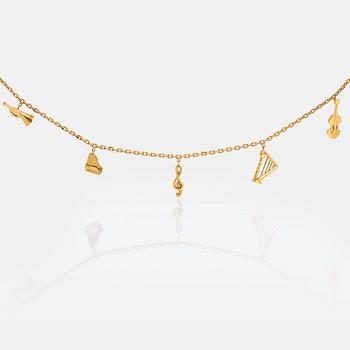 An 18K gold  Dior necklace with charms.