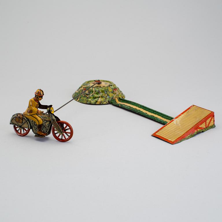 A tinplate Huki roundabout motorcycle, Germany, 1930s.