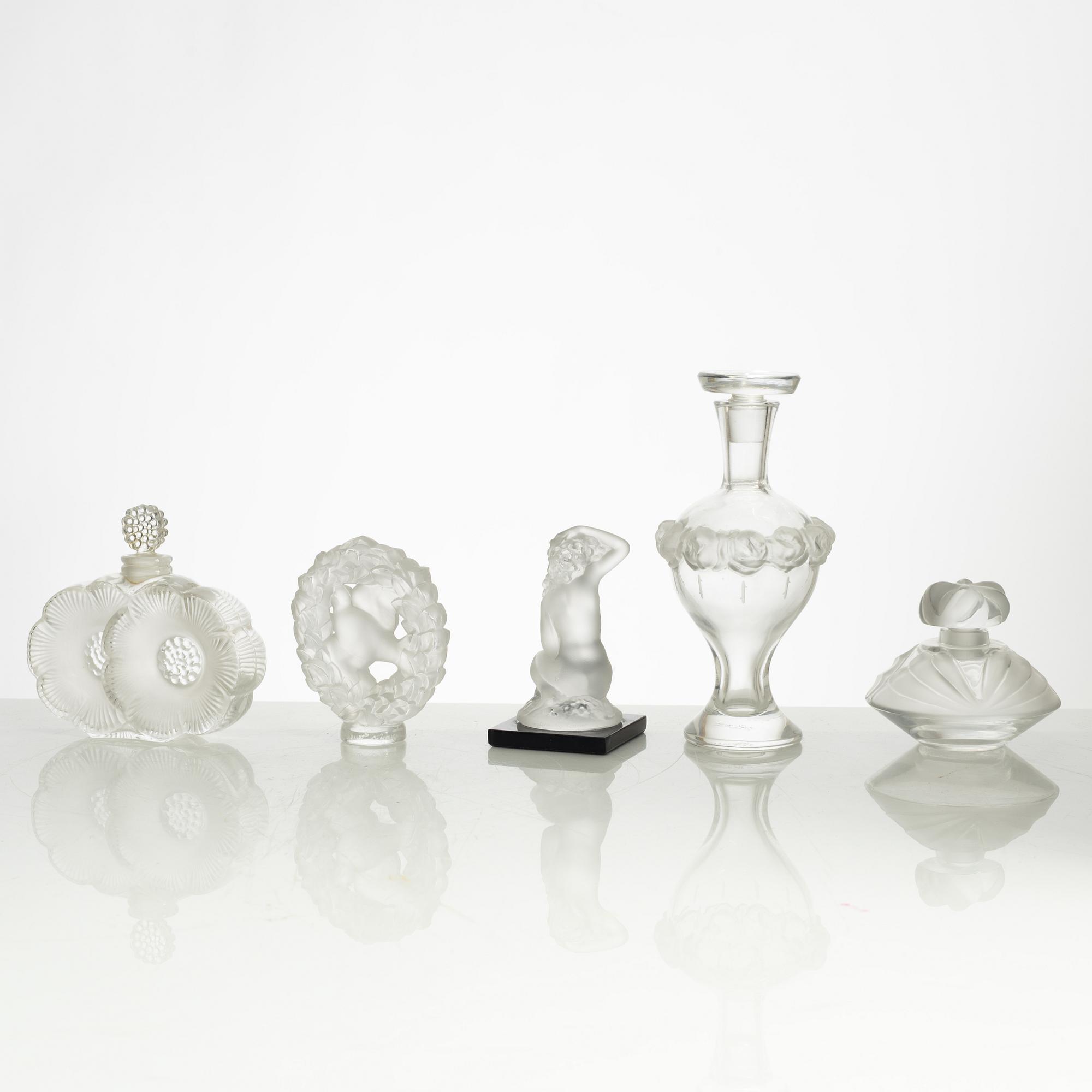 Lalique, four perfume bottles and five figurines, France, after 1945.
