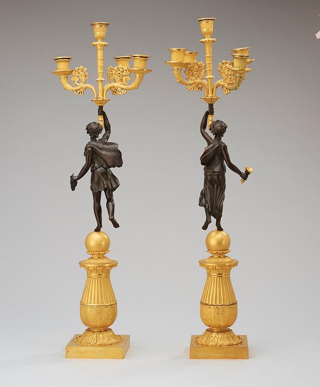 A pair of French Empire early 19th century five-light candelabra.