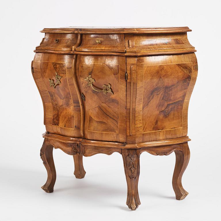 An Italian Louis XV-style bombé commode, later part 19th century.