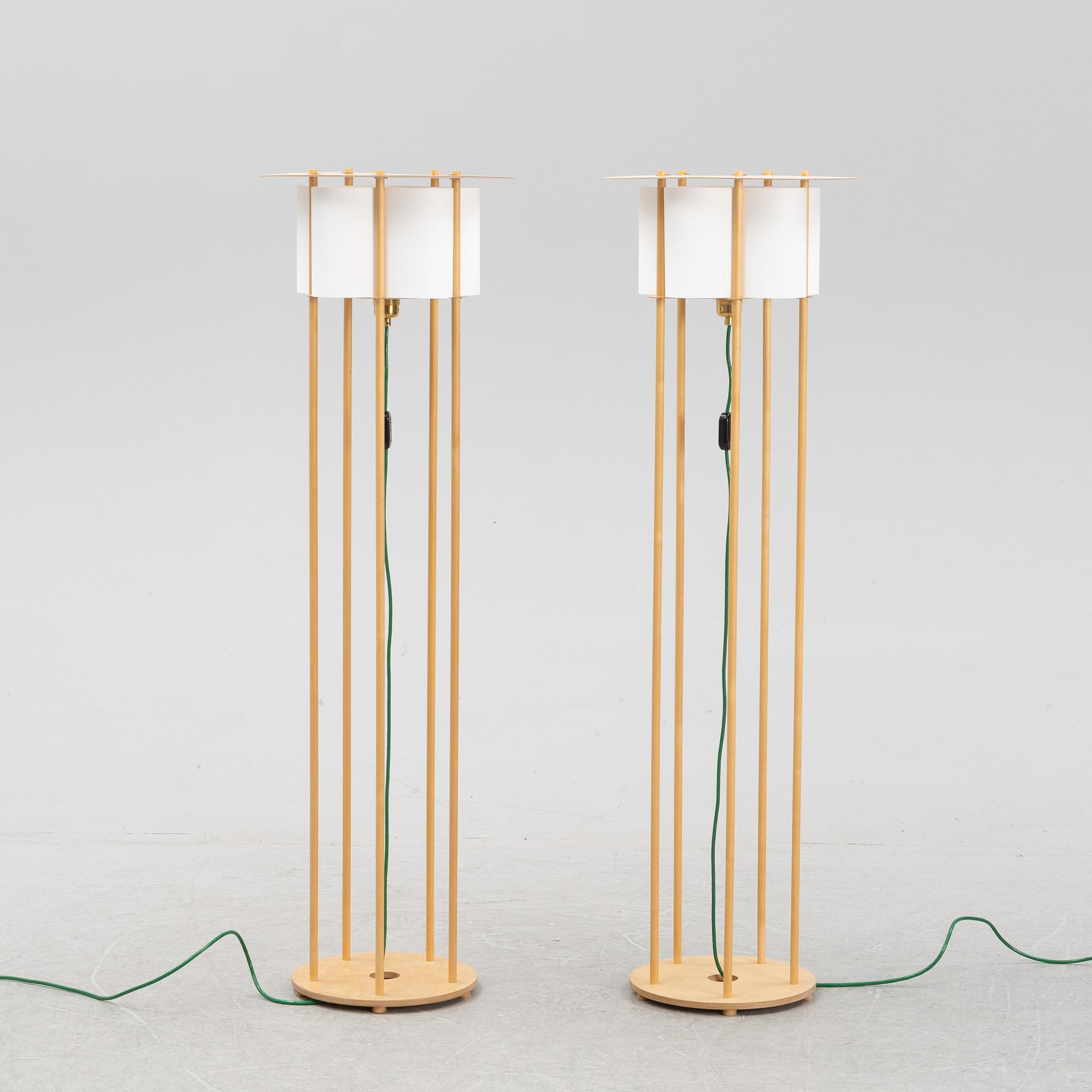 Torbjörn Ahlström, a pair of birch floor lights, dated 1993.