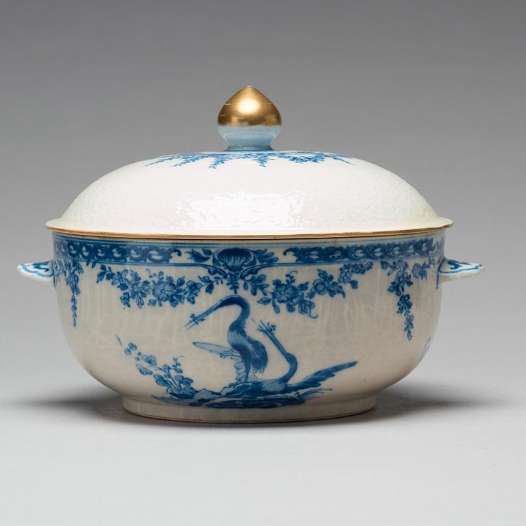 A blue and white armorial tureen with cover, and stand, Qing dynasty, 18th Century.