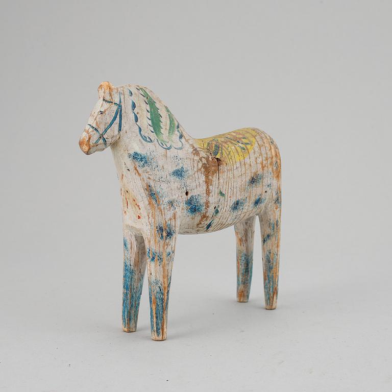 A painted Swedish wooden horse from the early 20th century.