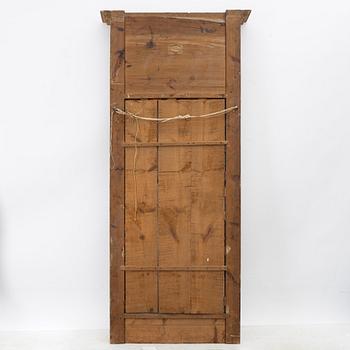 Empire, A late Empire mirror, first half of the 19th century.