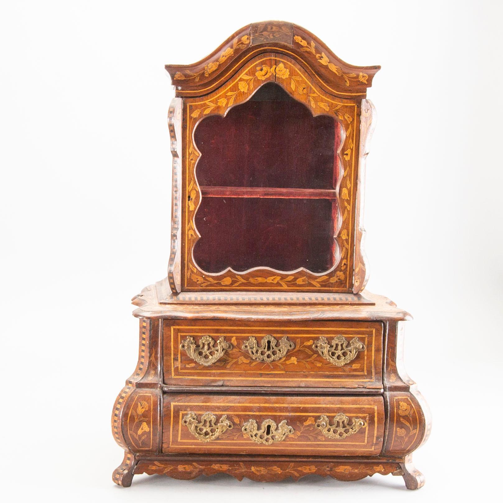 A Louis XV-style miniature cabinet around 1900.