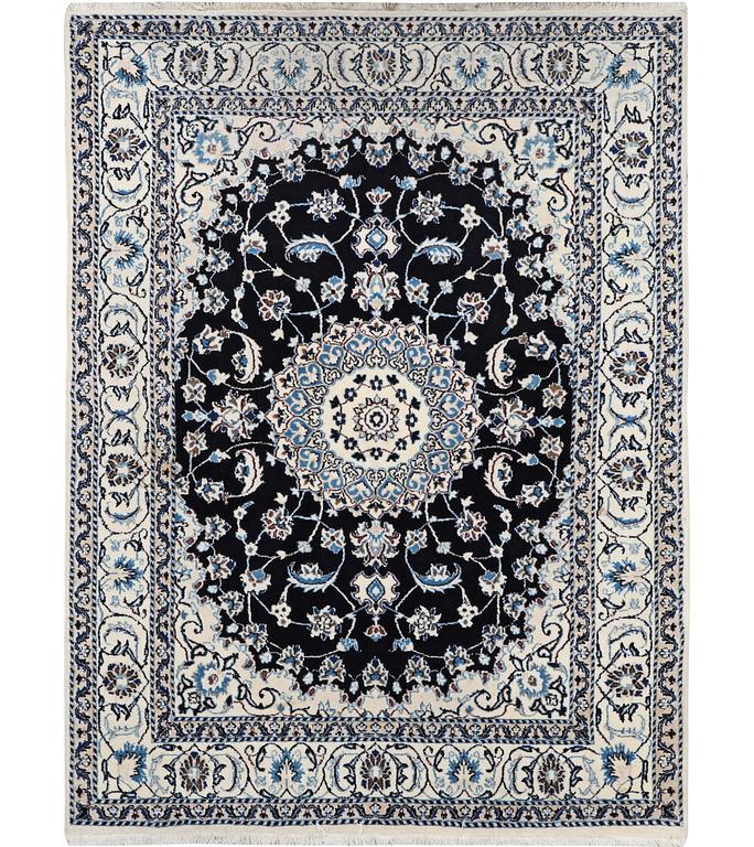 A carpet, Nain, part silk, c. 232 x 167 cm.