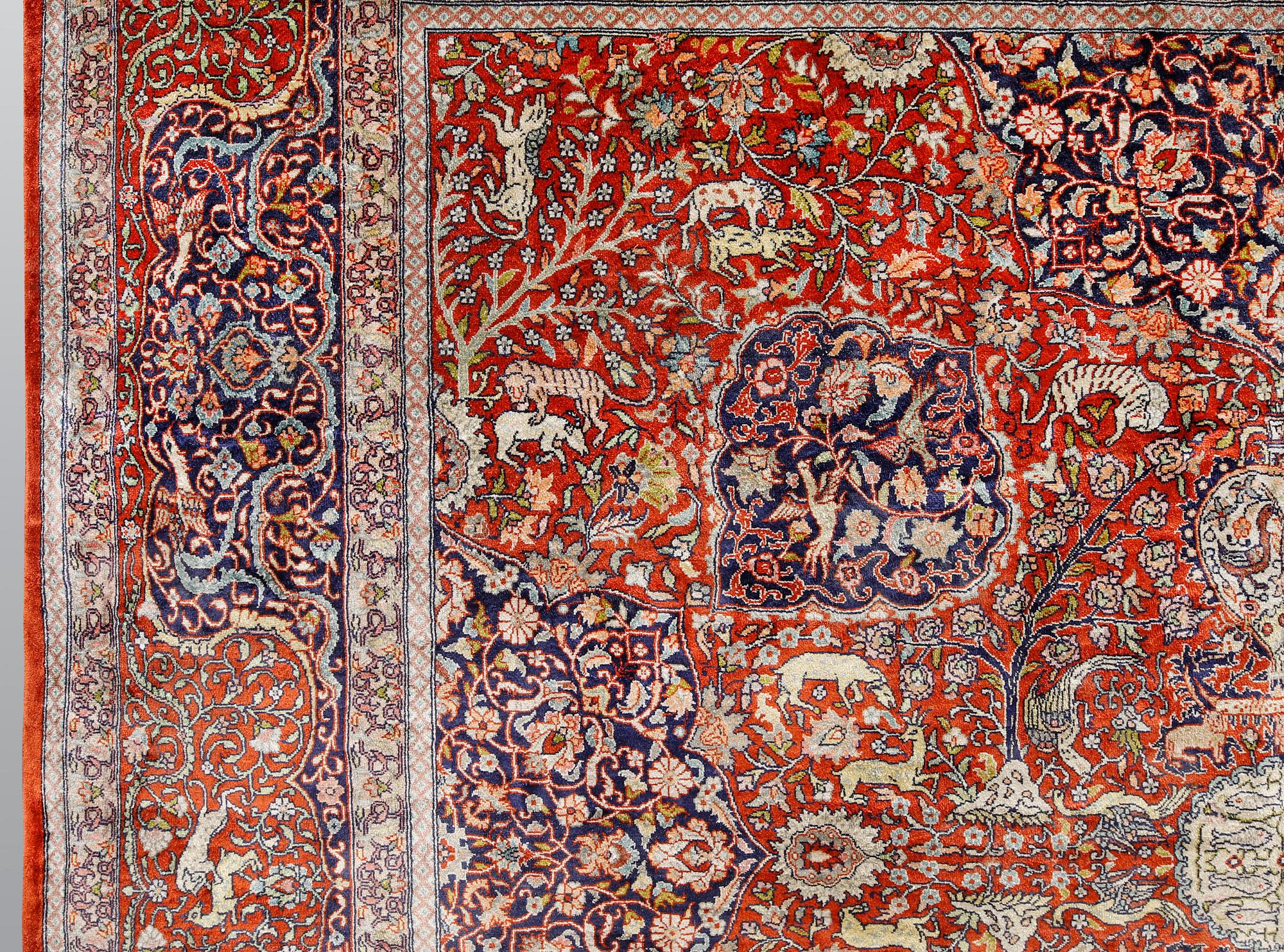 A pictoral orietal silk rug, 246 x 153 cm.