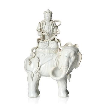 1034. A large blanc-de-chine figure of Guanyin riding an elephant, late Qing dynasty/early 20th Century.