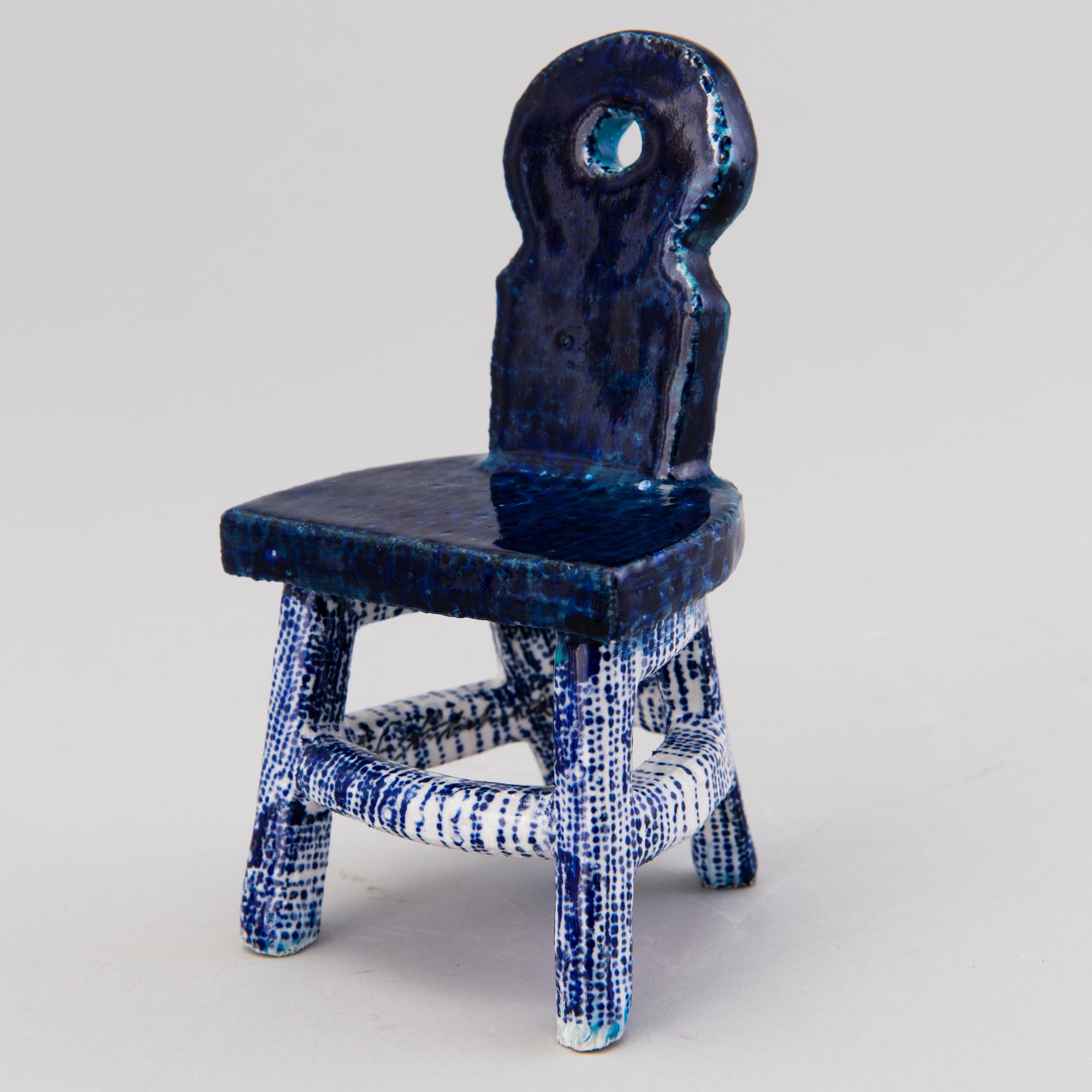 HEINI RIITAHUHTA, a porcelain miniature sculpture 'Chair' signed Heini Riitahuhta.