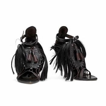 750. BALENCIAGA, a pair of brown and black leather sandalettes with pony hair.