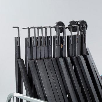 A 21st century showroom rug hanger.