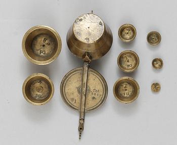 A brass set of measure, marked 1822.