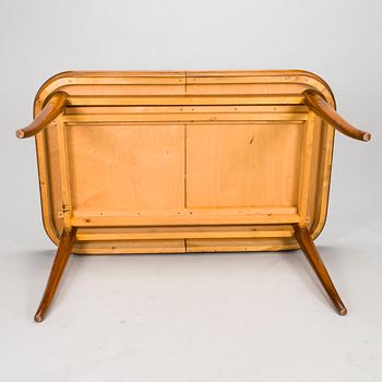 A mid 20th century dining table and a set of four chairs, Oy Boman Ab and two chairs Werner West.