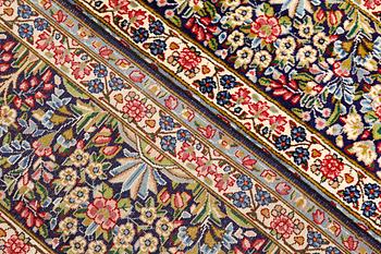 A Kirman Laver carpet, 'Millefleur', approx. 400 x 295 cm.