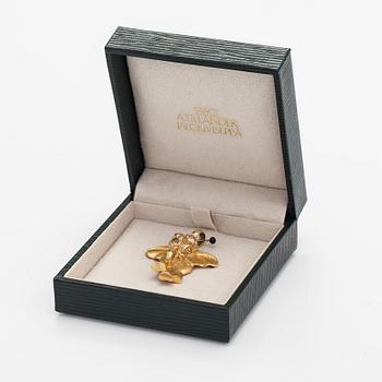 A 14K gold elefant shaped pendant.