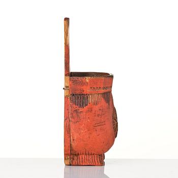 A Swedish folk art carved and painted spoon holder, 18th century.