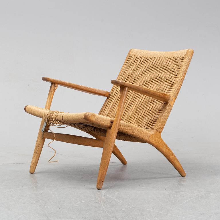 A 'CH-25' armchair designed by Hans J Wegner for Carl Hansen & Søn, Denmark.