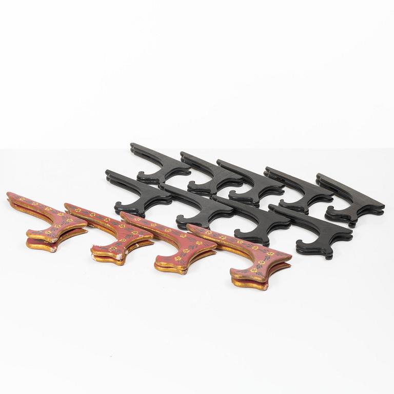 A group lot of 13 Chinese wooden stands, 20th century.