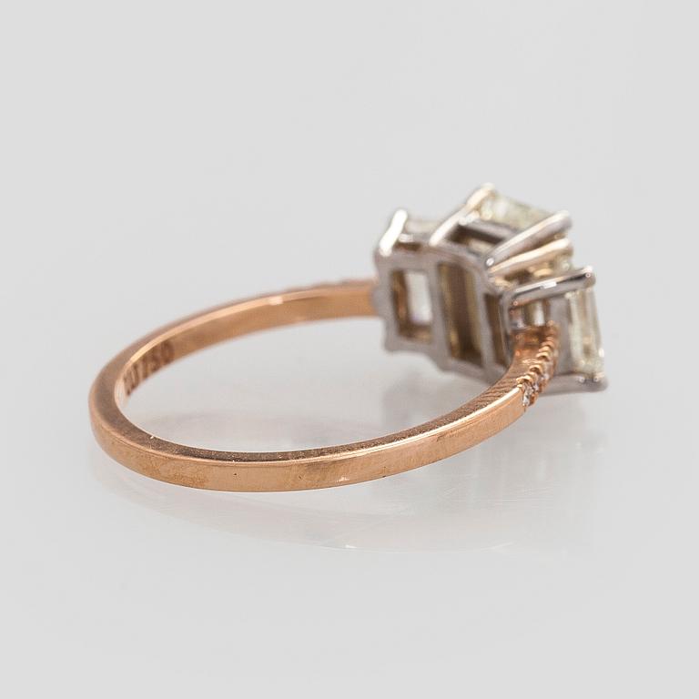 Ring, three baguette cut diamonds, small brilliant cut diamonds, 18K white gold and rose gold.